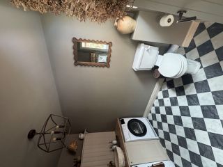traditional utility room with black and white checkerboard floor